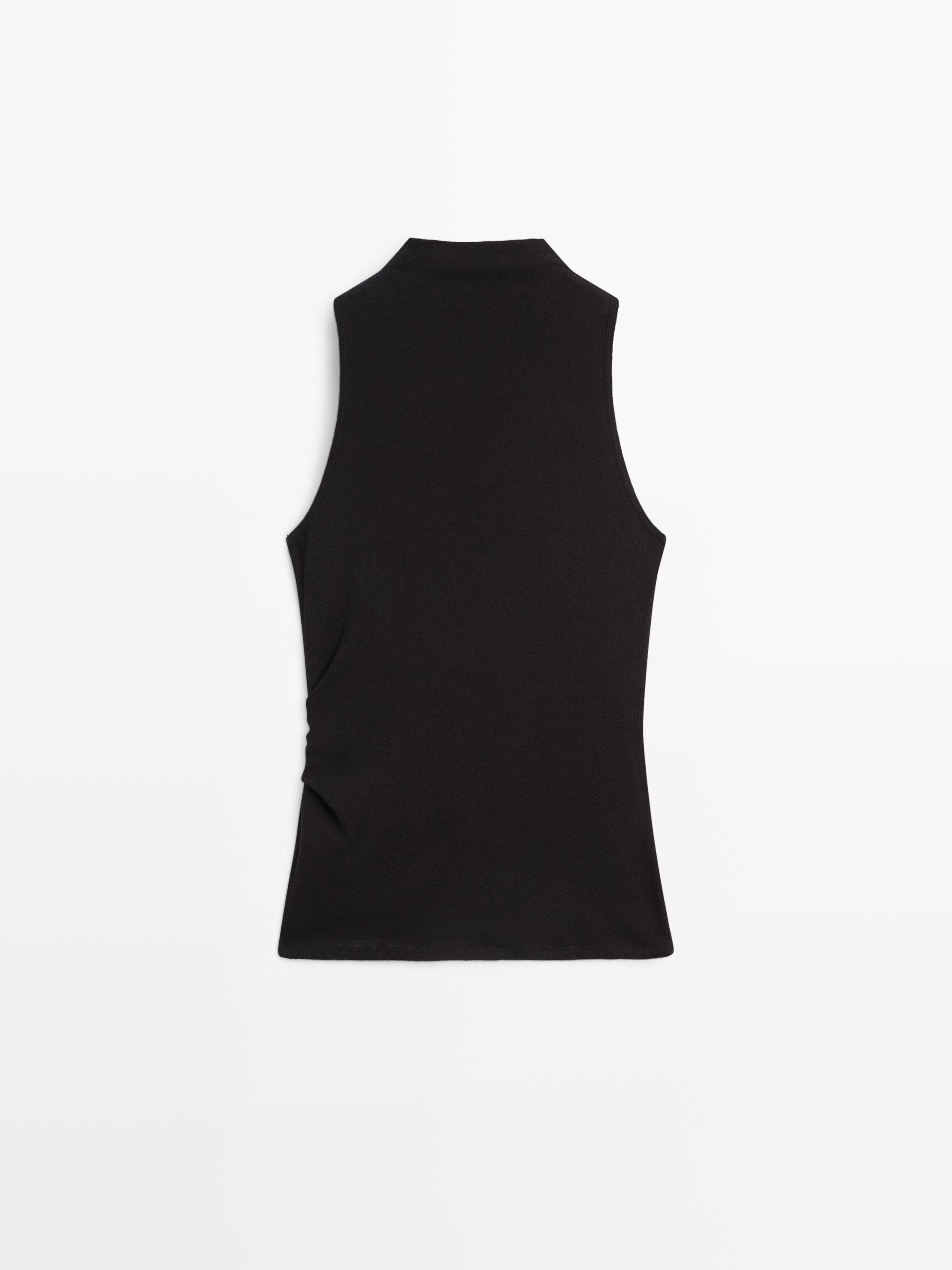 Funnel neck top with brooch detail